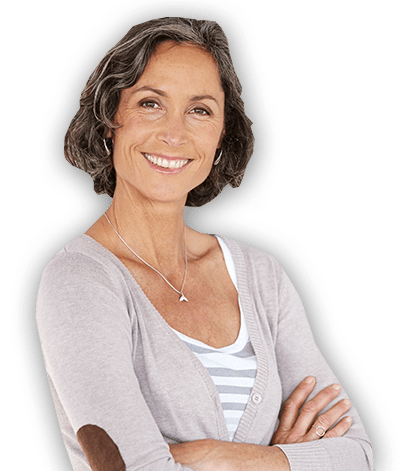 Mature woman standing with smile and crossed arms
