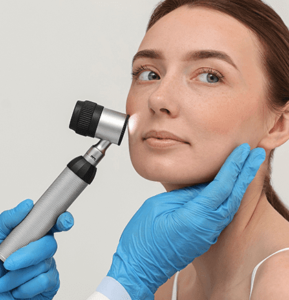 Dermatologist examining patient’s skin lesion for basal cell carcinoma