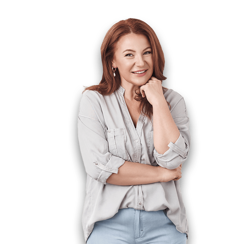Austin woman with red hair standing with a smile.