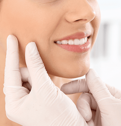 Dermatologist examining patient’s face for perioral dermatitis