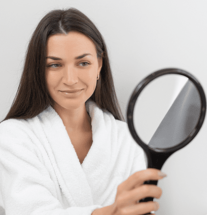 Dermatologist examining patient’s scalp for dandruff