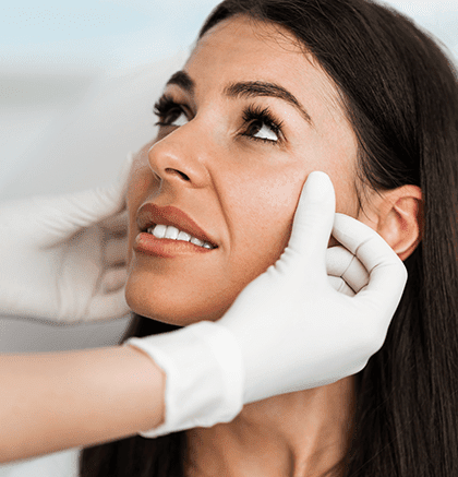 Dermatologist examining patient’s facial skin for melasma