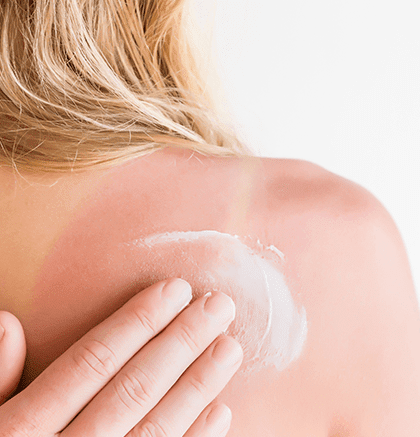 Dermatologist examining patient’s skin for sun damage